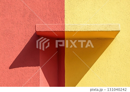 Bright colors and shadows create striking composition on a wall 131040242
