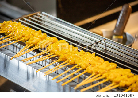 Skewer Raw Pork Satay on the grill grate Skewer Raw Pork Satay on the grill grate 131041697