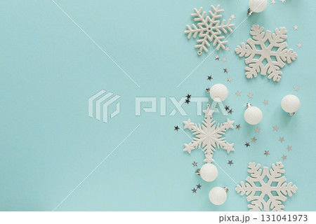 White Christmas Ornaments and Snowflakes on Light Blue Background White Christmas Ornaments and Snowflakes on Light Blue Background 131041973