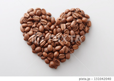 Coffee bean heart brown roast aroma love romantic shape arrangement on white background, warm cozy composition evokes affection and comfort 131042040