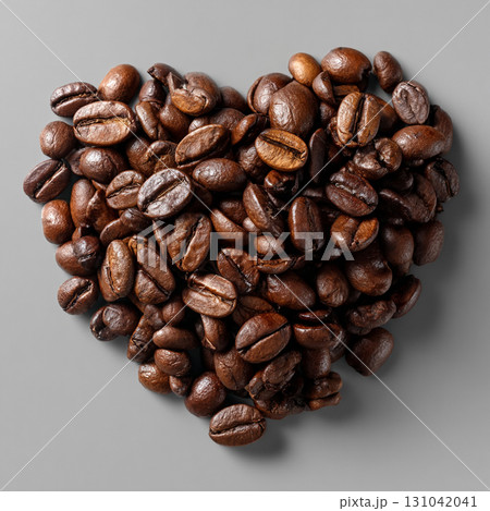 Roasted coffee bean heart, closeup texture and rich brown color, warm aromatic mood evoking love for beverage 131042041