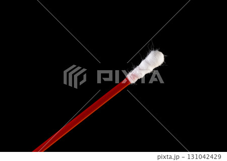 one stick with cotton for hygienic procedures, red sticks with natural white cotton at the ends for personal hygiene 131042429