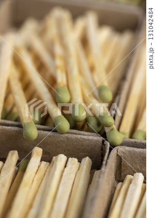 a lot of matchboxes with matches, matchboxes with matches made of wood, close up 131042484