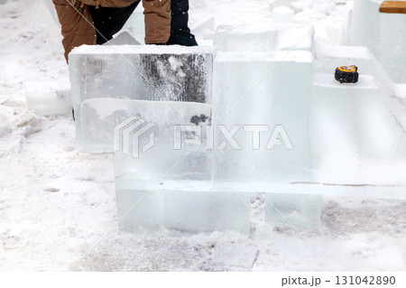 Ice sculpture creation on the city's central square 131042890