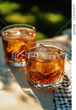 Refreshing Iced Drinks on a Sunny Table in a Cozy Outdoor Setting During Afternoon Relaxation Time Refreshing Iced Drinks on a Sunny Table in a Cozy Outdoor Setting During Afternoon Relaxation Time 131042977