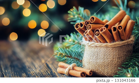 Cinnamon Sticks in Burlap Bags Surrounded by Holiday Decorations in a Cozy Setting. 131043166
