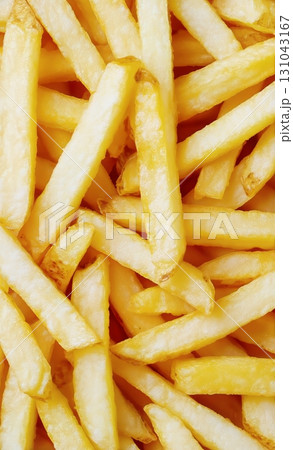 Crispy Golden French Fries Piled High, Perfect for Snacking or Sharing at Any Gathering or Meal 131043167