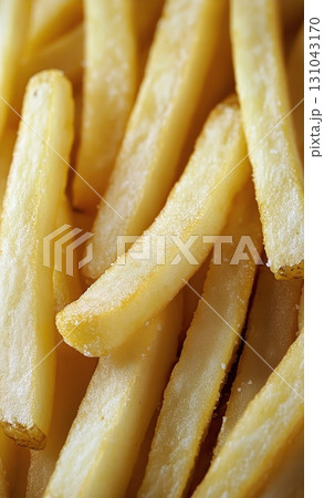 Crispy Golden French Fries Piled Together in a Delicious, Tempting Display at a Fast Food Restaurant. 131043170