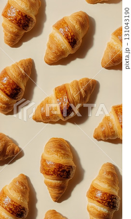 Croissants Arranged Beautifully on a Beige Background for a Delightful Visual Feast 131043190