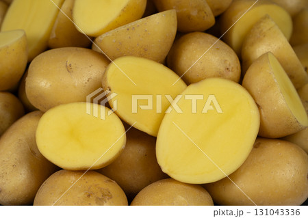 Fresh Raw Potatoes Cut In Half Close-Up Macro View. 131043336