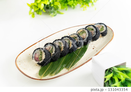 Saba-maki roll with rice, nori, flying fish roe Saba-maki roll with rice, nori, flying fish roe 131043354