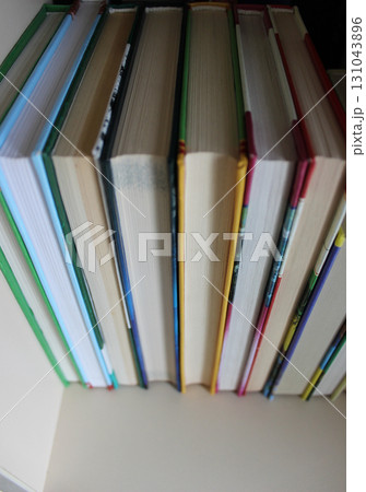 Books in a hard cover are arranged with a book block towards the viewer Books in a hard cover are arranged with a book block towards the viewer 131043896