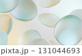 Frosted glass disks overlapping softly against pastel backdrop, generating ethereal depth with translucent geometric shapes and delicate visual harmony 131044693