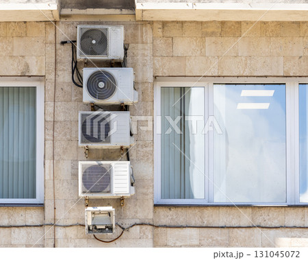 Air conditioners on the facade of the house, ventilation and cooling system. Air conditioners on the facade of the house, ventilation and cooling system. 131045072