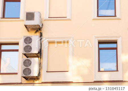 air conditioners are installed on the wall of the building. cooling in hot weather. 131045117