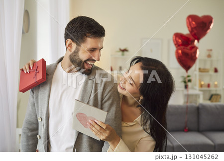 Woman in love happily wishes her husband Happy Valentines Day, creating special memory. 131045262