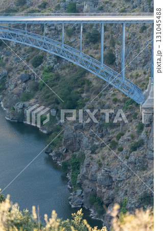 Dramatic Bridge Over Rocky Canyon Landscape Dramatic Bridge Over Rocky Canyon Landscape 131045488