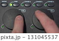Close-up of hands adjusting Pan and Tilt shuttle controls on lighting console 131045537