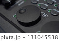 Close-up: finger adjusts Pan shuttle on lighting console 131045538