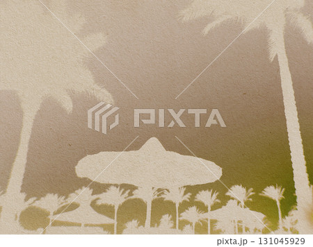 Tropical resort silhouette with palm trees and beach umbrellas. An artistic image featuring a coast scene 131045929