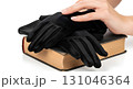 Blank velvet gloves placed on vintage book, isolated Blank velvet gloves placed on vintage book, isolated 131046364