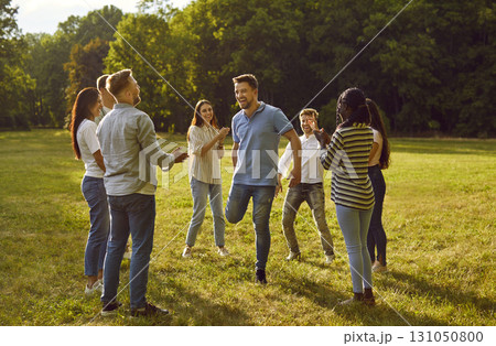 Group of excited happy friends students or colleagues having fun in nature in summer park. Group of excited happy friends students or colleagues having fun in nature in summer park. 131050800
