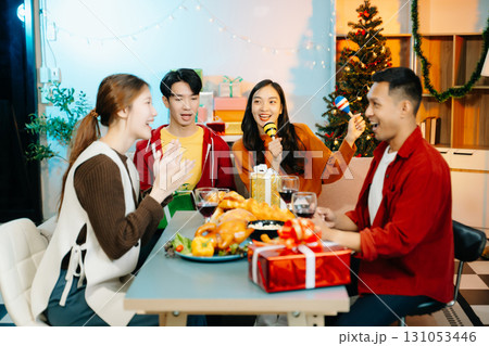 Group of Young Asian friend having, enjoy evening party together at home. 131053446