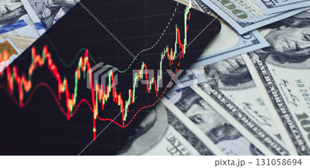 Stock trading chart on phone with US dollars 131058694