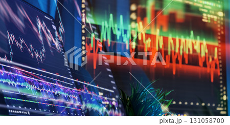 Multiple trading monitors showing financial data Multiple trading monitors showing financial data 131058700