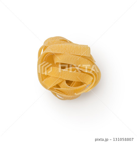 Dry fettuccine pasta on white background top view 131058807