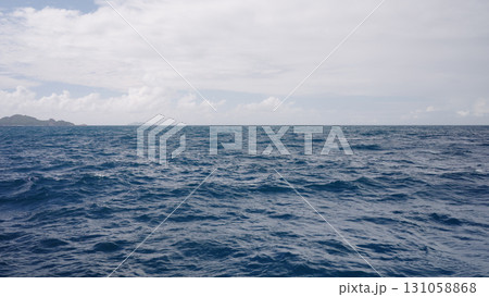 Side view from boat in Indian ocean sailing between Seychelles islands in daytime Side view from boat in Indian ocean sailing between Seychelles islands in daytime 131058868