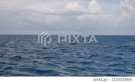 Side view from boat in Indian ocean sailing between Seychelles islands in daytime Side view from boat in Indian ocean sailing between Seychelles islands in daytime 131058869