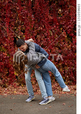 Young Cute Female Hugs Boyfriend. In Autumn Outdoor. Lovers Walking in Park. Attractive Funny Couple. Lovestory in Forest. Man and Woman. Cute Lovers in the Park. Family Concept. Happy Couple. Young Cute Female Hugs Boyfriend. In Autumn Outdoor. Lovers Walking in Park. Attractive Funny Couple. Lovestory in Forest. Man and Woman. Cute Lovers in the Park. Family Concept. Happy Couple. 131059603