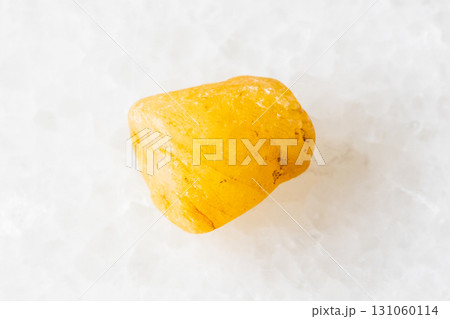 sample of raw yellow sapphire crystal on white sample of raw yellow sapphire crystal on white 131060114