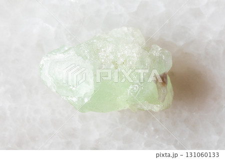 sample of raw herderite mineral on white marble 131060133