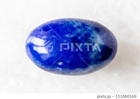 sample of polished lapis lazuli mineral on white sample of polished lapis lazuli mineral on white 131060169
