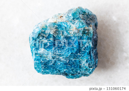 sample of rough blue apatite rock on white 131060174