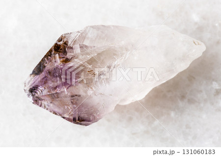 sample of raw amethyst quartz crystal on white 131060183