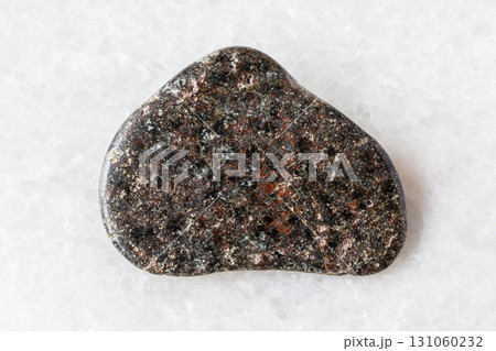 polished basalt with hematite mineral on white 131060232