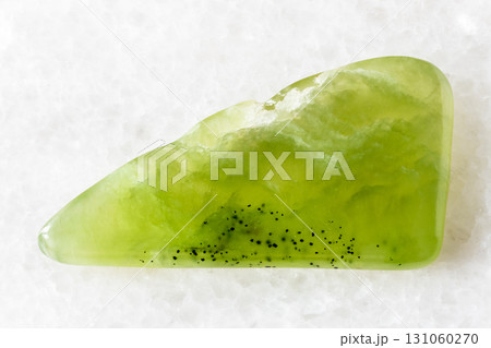 sample of polished vesuvianite rock on white sample of polished vesuvianite rock on white 131060270