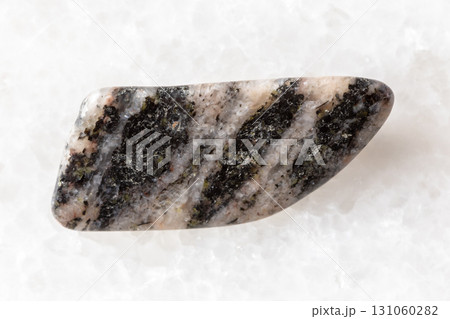 sample of polished gneiss rock on white marble sample of polished gneiss rock on white marble 131060282
