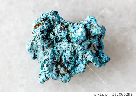 sample of raw shattuckite mineral on white marble 131060292