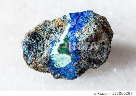 raw azurite and malachite mineral on white marble 131060297
