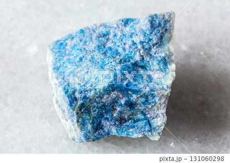 sample of rough lazurite mineral on white marble sample of rough lazurite mineral on white marble 131060298