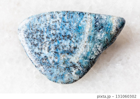 sample of polished dianite rock on white marble 131060302