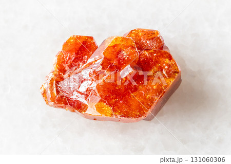 sample of rough vanadinite crystal on white marble sample of rough vanadinite crystal on white marble 131060306