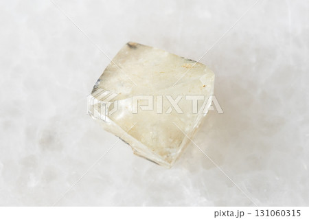 sample of rough topaz crystal on white marble 131060315
