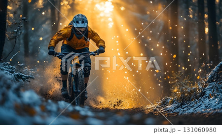 Mountain Biker Riding Through Forest Trail at Sunset 131060980
