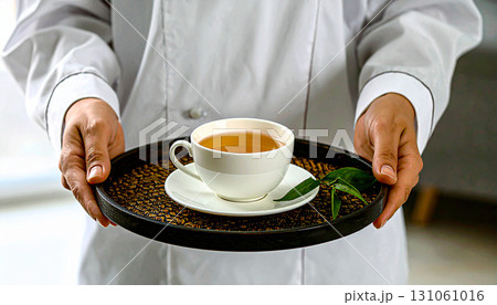 Chef serving tea on tray with fresh tea leavesのイラスト素材 [131061016] - PIXTA