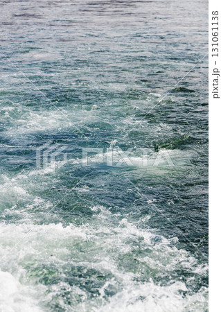water churned up by ship propeller in Avacha bay 131061138